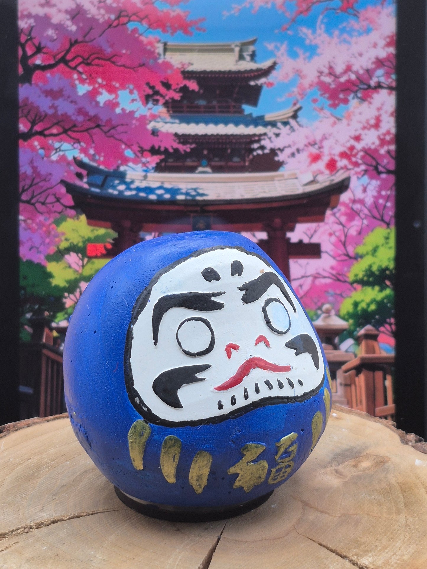 Daruma en plâtre peint à la main.